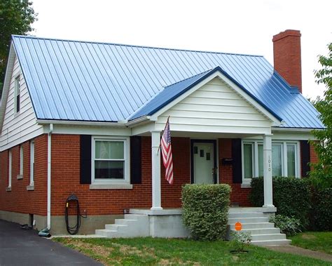 metal roof on brick house with white doors and windows|brick house metal roof colors.